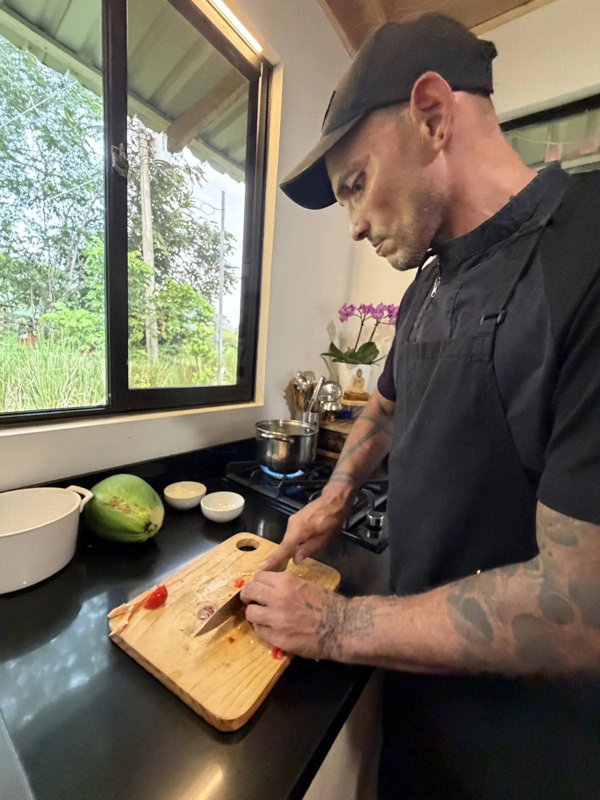 Chef Pedro preparing a dish in the kitchen